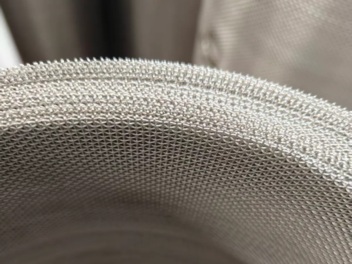 Close-up macro detail of stainless steel square wire mesh weave
